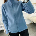 Women's windbreaker jacket made of thick fleece, ideal for outdoor activities in spring, autumn, and winter. Made of double-sided polyester with a regular fit.